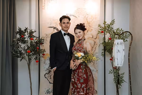 Chinese tea ceremony backdrop with ink painting hanging cloth, nandina floor plants with red lanterns, and bamboo LED floor lamp