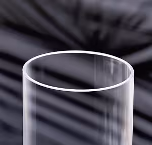 Close-up of the Minimalist Cylinder Clear Glass Vase rim showing thin polished edges and transparent walls against dark draped fabric