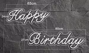 Happy Birthday LED Neon Light Signage size diagram showing two pieces: Happy at 65x24cm and Birthday at 85x27cm on dark stone